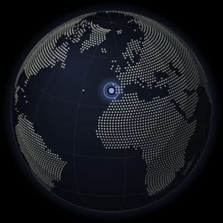 A globe with a pin on Portugal